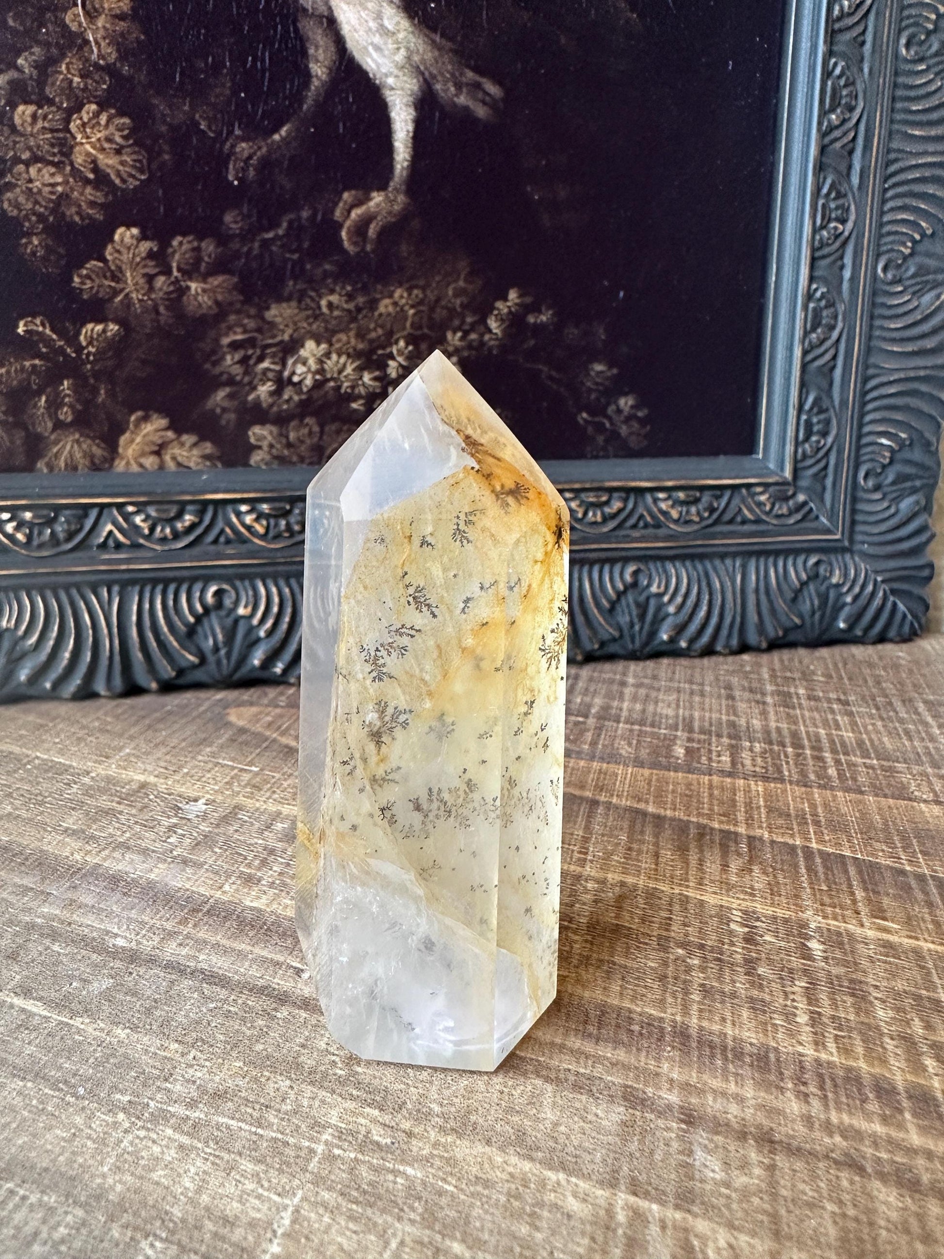 Transparent dendritic quartz tower with golden healer