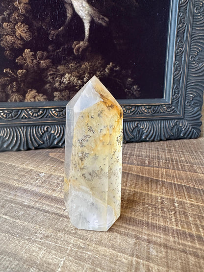 Transparent dendritic quartz tower with golden healer