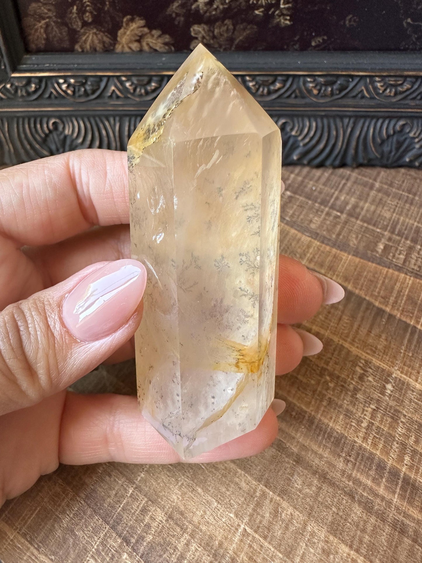 Transparent dendritic quartz tower with golden healer
