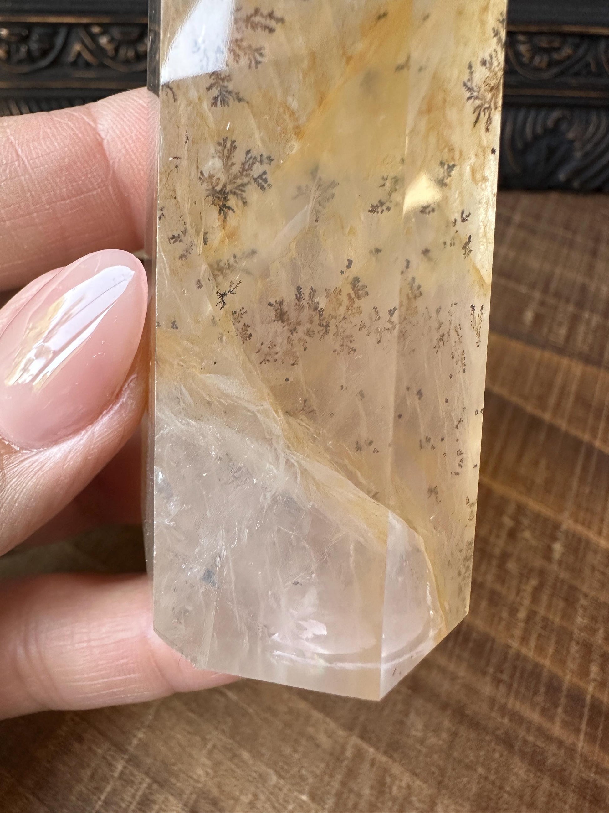 Transparent dendritic quartz tower with golden healer