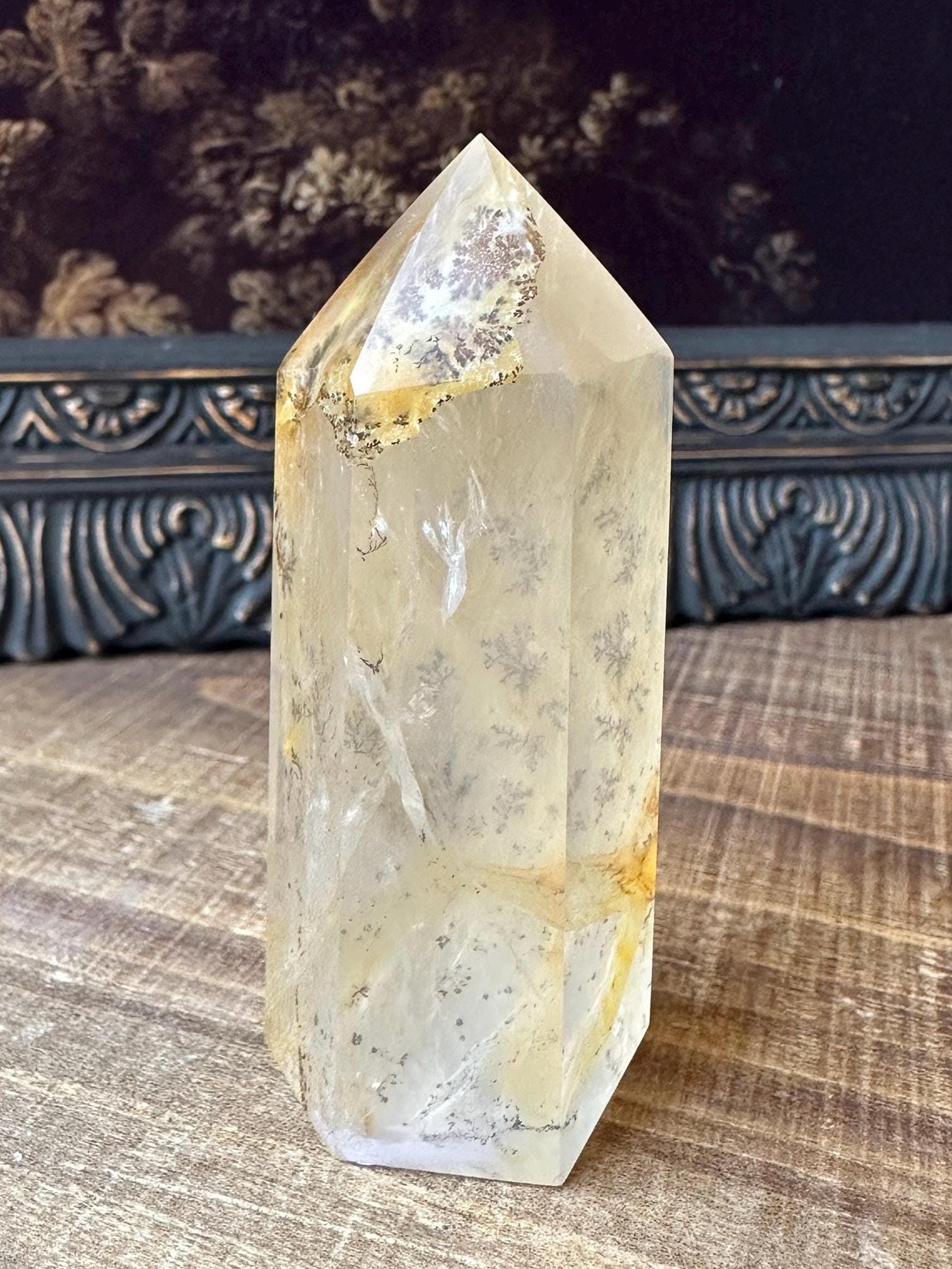 Transparent dendritic quartz tower with golden healer