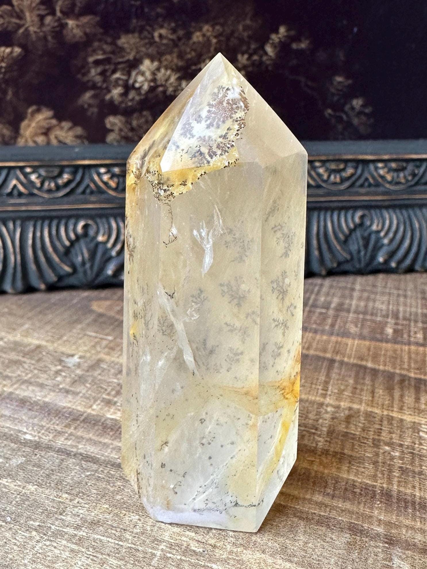 Transparent dendritic quartz tower with golden healer