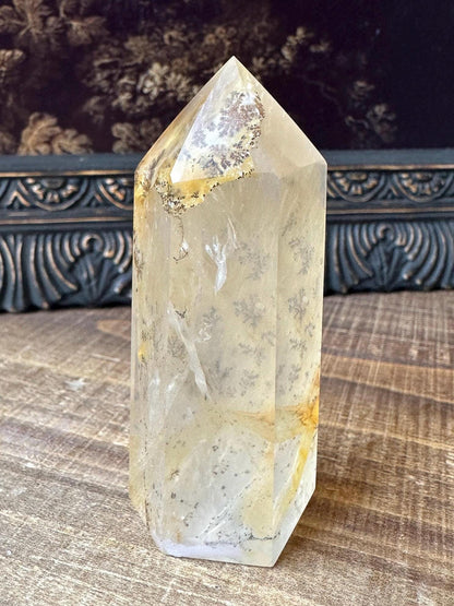 Transparent dendritic quartz tower with golden healer
