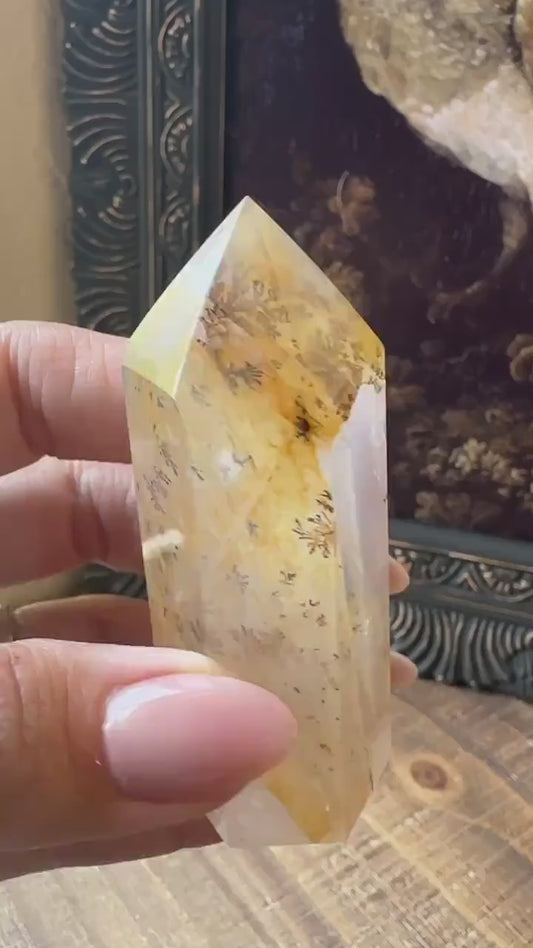 Transparent dendritic quartz tower with golden healer